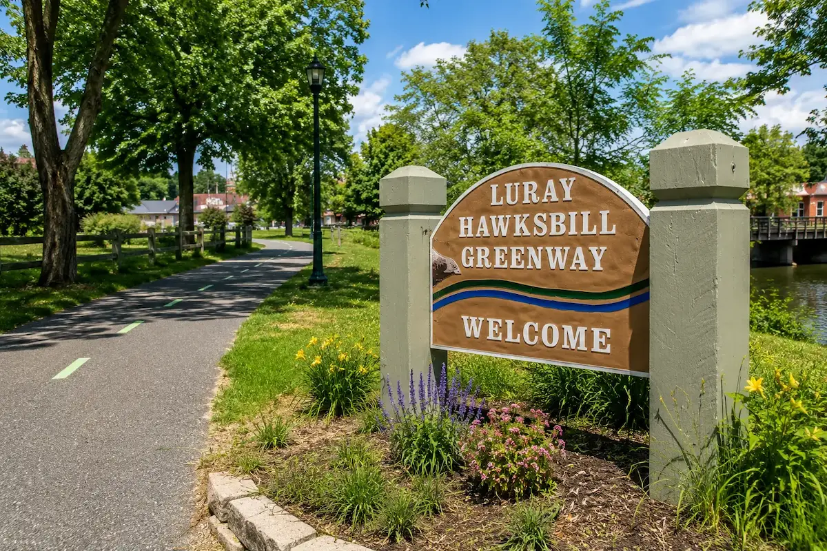 Luray-Hawksbill Greenway welcome sign beside the paved trail